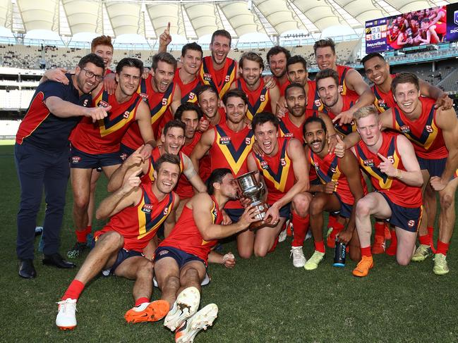 PERTH, AUSTRALIA - MAY 12: The SANFL team pose with the Haydn Bunton Jnr Cup after winning the state game between WA and SA at Optus Stadium on May 12, 2019 in Perth, Australia. (Photo by Paul Kane/Getty Images)