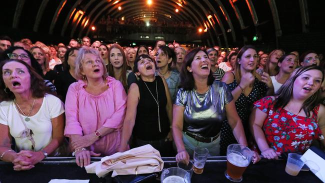 Pub Choir participants use their ‘instruments’. Picture: Lyndon Mechielsen.