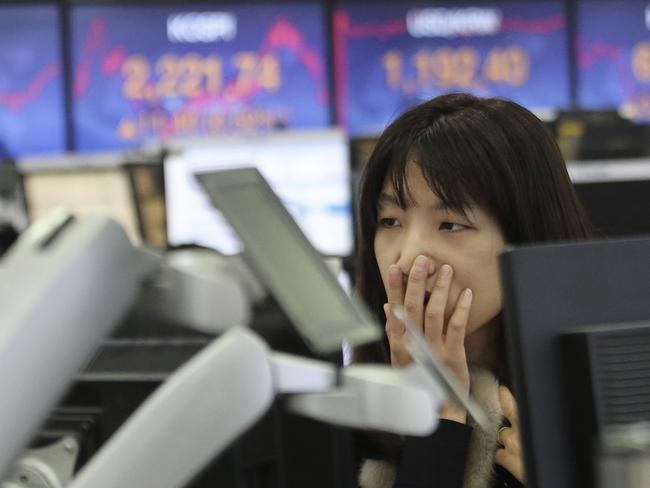 A trader watches monitors the market. Picture: AP