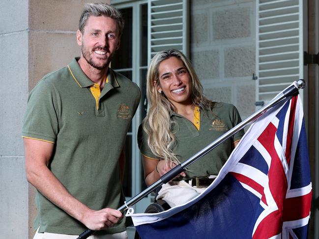 SYDNEY, AUSTRALIA - JULY 12: Madison de Rozario and Brenden Hall pose with the Australian flag during a media opportunity announcing the  Australian Flag Bearers for Paris 2024 Paralympic Opening Ceremony at Admiralty House on July 12, 2024 in Sydney, Australia. (Photo by Brendon Thorne/Getty Images)