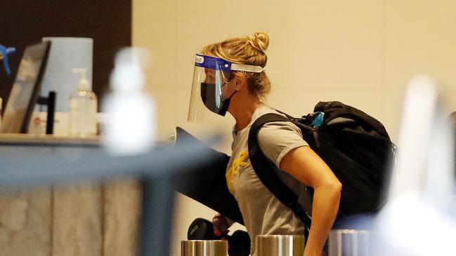 Guests pictured arriving from the Grand Chancellor to The Westin in Brisbane after being moved due to the UK variant strain of COVID-19. Picture: Josh Woning