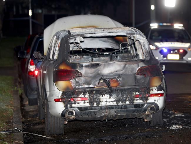 A burnt-out car was found nearby, on the corner of Presland Ave and Paten St. Police are investigating if it is linked to the shootings. Picture: Damian Shaw