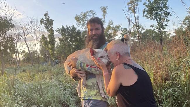 TC holds Dobby as she is embraced by Ms Trotter the moment she was found.. Picture: Supplied