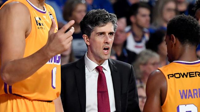 Andrew Bogut (left) and Sydney Kings coach Will Weaver (centre) are seen talking to players during the Round 6 NBL match between the Brisbane Bullets and the Sydney Kings at the Queensland State Netball Centre in Brisbane, Friday, November 8, 2019. (AAP Image/Darren England) NO ARCHIVING, EDITORIAL USE ONLY