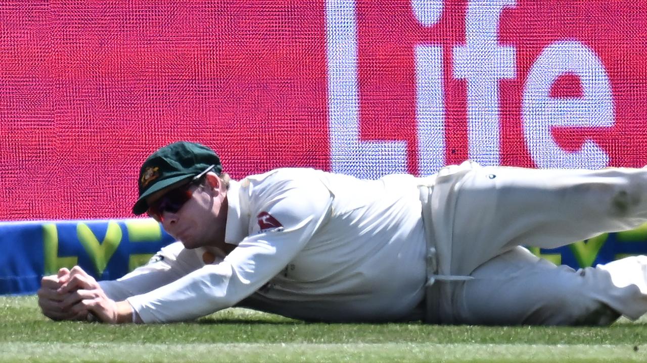 Australia's Steven Smith takes a magnificent catch on the boundary to dismiss Stuart Broad. Picture: AFP