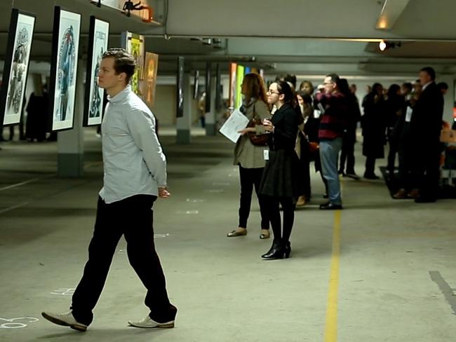 The crowd enjoys the art at the 2015 Urban Art Parked event at the Wilson carpark at North Sydney.