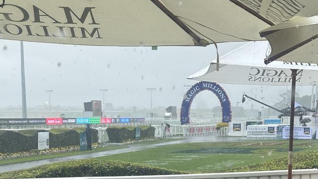 A heavy downpour after race three has put the Magic Millions race day in limbo.