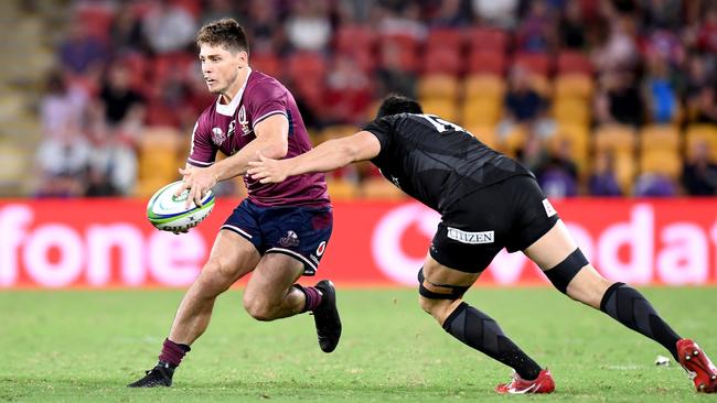 BRISBANE, AUSTRALIA - FEBRUARY 22: James O'Connor of the Reds takes on the defence during the round four Super Rugby match between the Reds and the Sunwolves at Suncorp Stadium on February 22, 2020 in Brisbane, Australia. (Photo by Bradley Kanaris/Getty Images)