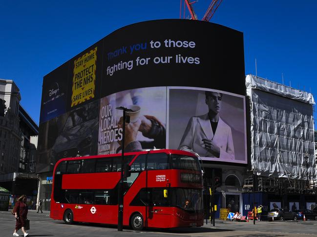 Messages in support of the key workers on the advertising facade of Piccadilly Circus. Picture: AP.