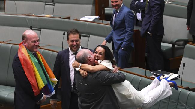 Liberal MP Warren Entsch celebrates after yesterday’s vote with Labor’s Linda Burney, who had dedicated the same-sex marriage bill to her late gay son. Picture: AAP