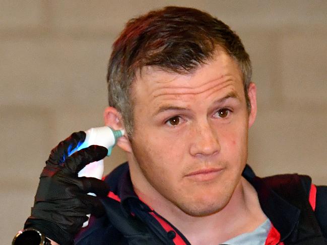 Roosters player Brett Morris is temperature tested on arrival prior to the Round 4 NRL match the Brisbane Broncos and the Sydney Roosters at Suncorp Stadium in Brisbane, Thursday, June 4, 2020. (AAP Image/Darren England) NO ARCHIVING, EDITORIAL USE ONLY