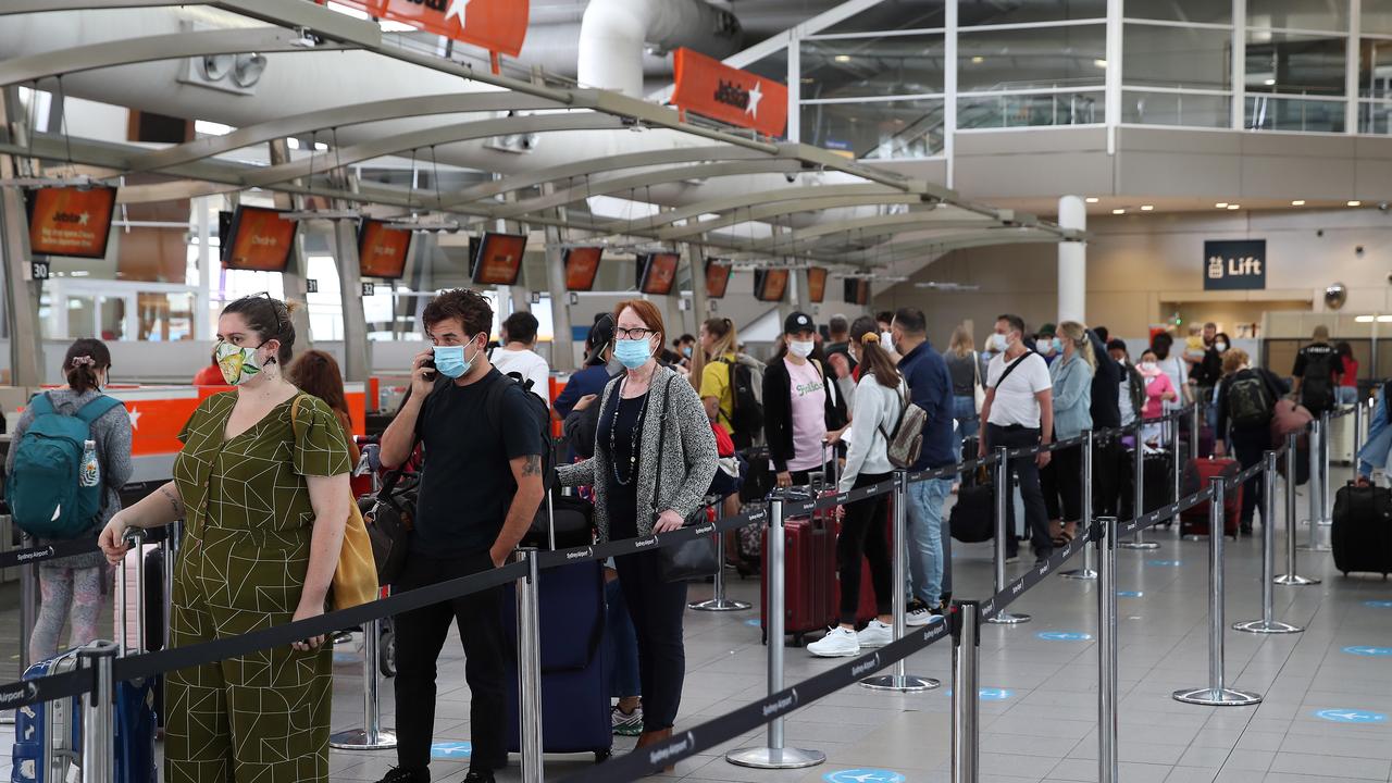 Terminal 2 at Sydney Airport Departures this morning as travellers look to get out of Sydney as Covid cases increase on the northern beaches and Central Coast. Picture: David Swift