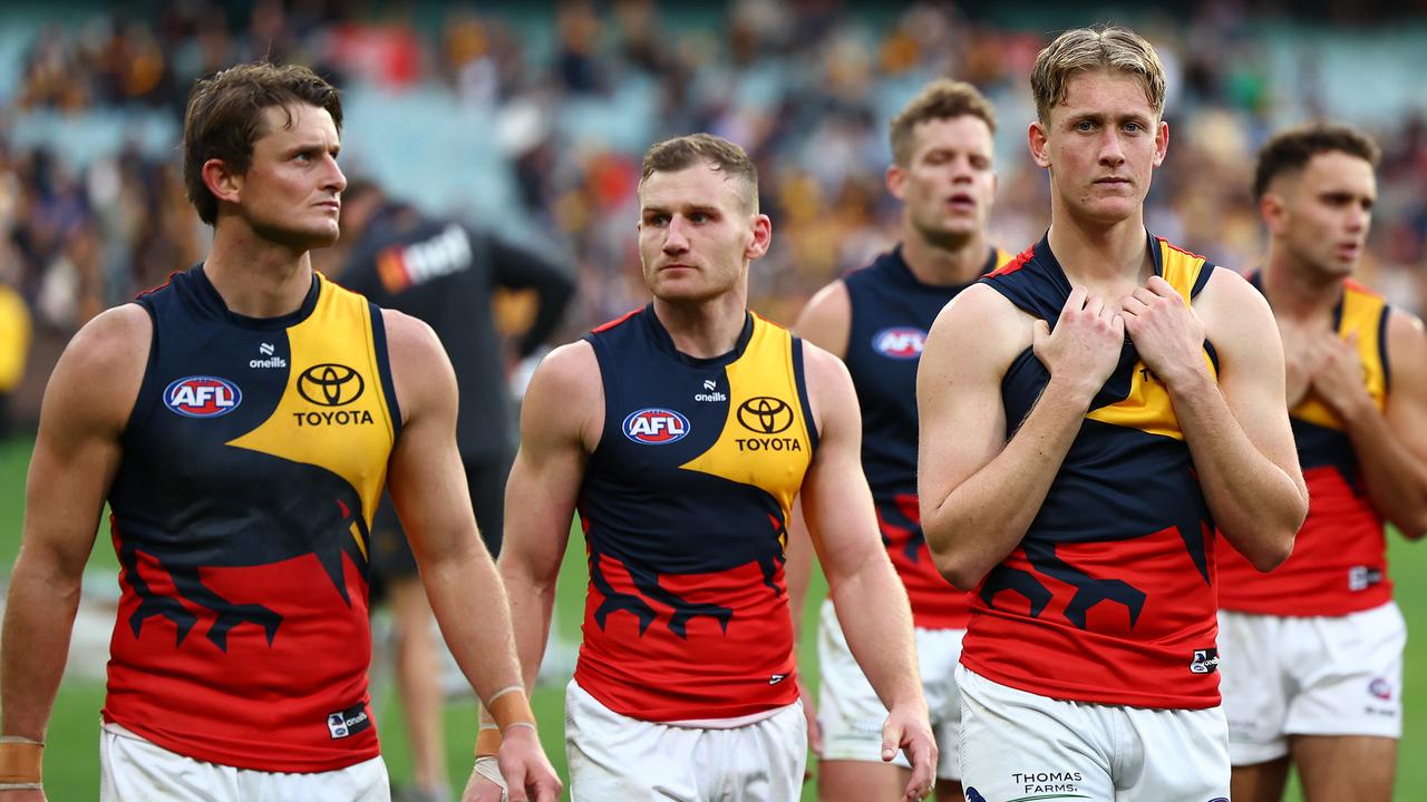MELBOURNE, AUSTRALIA - JUNE 01: Brayden Cook and his Crows' team mates look dejected after losing the round 12 AFL match between Hawthorn Hawks and Adelaide Crows at Melbourne Cricket Ground, on June 01, 2024, in Melbourne, Australia. (Photo by Quinn Rooney/Getty Images)