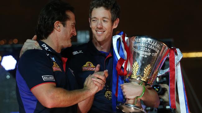 Luke Beveridge and Bob Murphy take some time to enjoy the premiership cup. Picture: Michel Klein