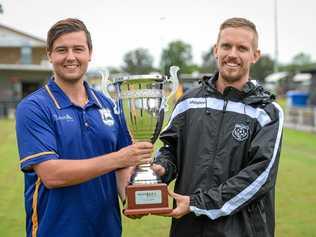 READY TO BATTLE: The Waves captain Callum Hillier with Bingera captain Daniel Watson pose with the Triple M Division 1 Cup. Picture: Brian Cassidy