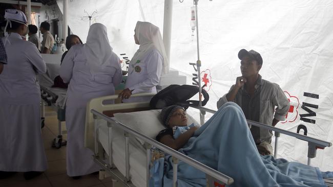 Patients are evacuated outside a hospital following the earthquake. Picture: AP