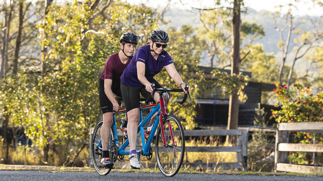 Fifteen-year-old Mitchell Wilkes, pictured training with mum Lisa Wilkes, has a degenerative eye condition and competes in tandem triathlon, Thursday, October 17, 2024. Picture: Kevin Farmer