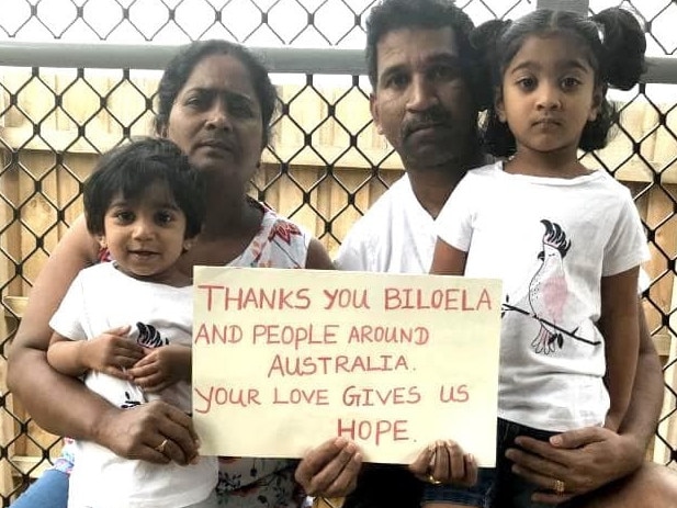 Kokilapath­mapriya Nadarasa and Nadesalingam Murugappan with Kopika, 4, and Tharunicaa, 2. Picture: AAP