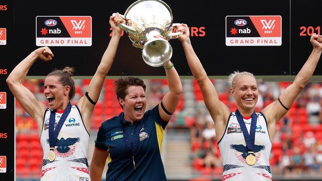 Chelsea Randall, Bec Goddard and Erin Phillips lift the inaugural AFLW premiership cup after beating Brisbane in the 2017 AFLW grand final. Picture: Michael Willson/AFL Media/Getty Images