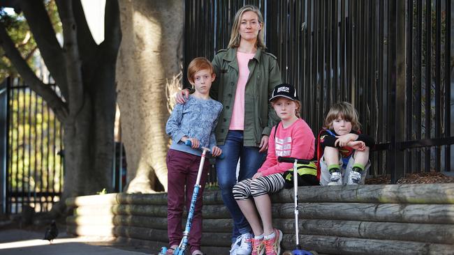 Louise Heywood is concerned up to 80 places could be cut at the school’s before and after care program if the bureaucrats don’t move out. Pictured with her kids Rufus, Macy and Hamish