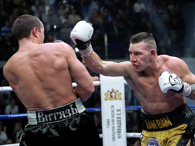 Mark Flanagan goes after Russian great Denis Lebedev in their WBA cruiserweight title fight. (Photo by Valery Sharifulin\TASS via Getty Images)