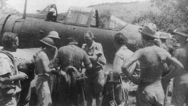 RAAF Squadron Leader John Jackson receiving medical attention on his return to Port Moresby after his plane was shot down.