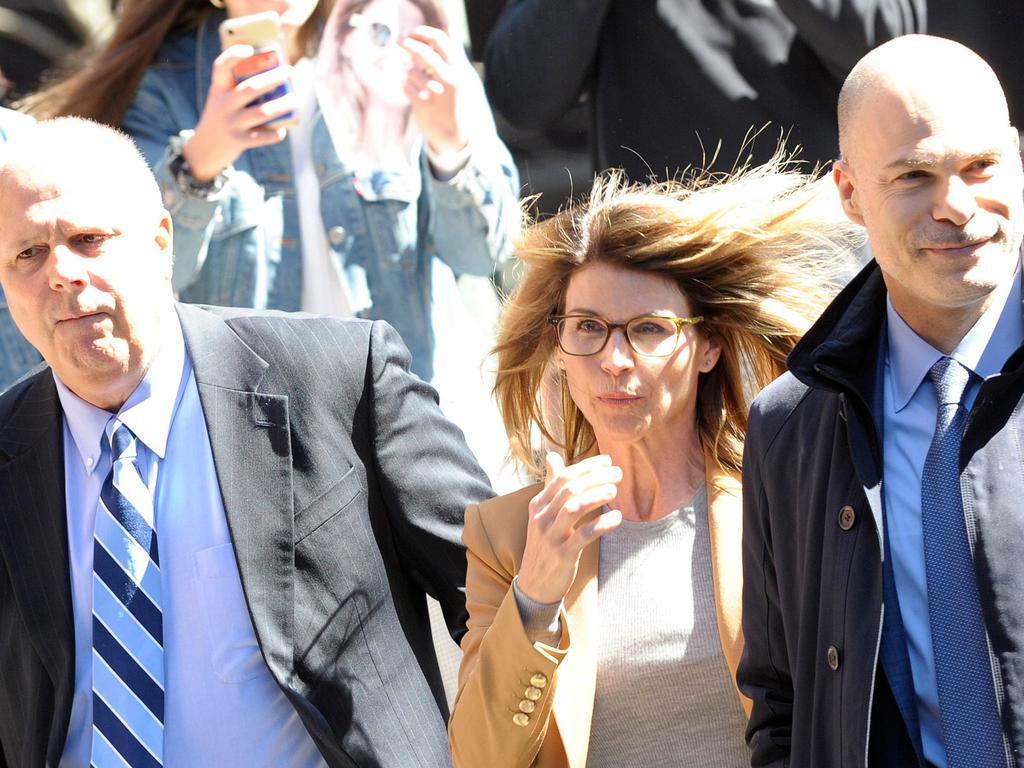 Actress Lori Loughlin (C) arrives at the court to appear before Judge M. Page Kelley to face charge for allegedly conspiring to commit mail fraud.  Picture:  AFP