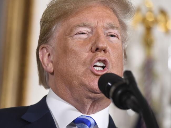 US President Donald Trump announces his decision on the Iran nuclear deal in the Diplomatic Reception Room at the White House in Washington, DC, on May 8, 2018. Trump on Tuesday announced the US withdrawal from what he called the "defective" multinational nuclear deal with Iran, and said Washington would reinstate sanctions against the Islamic republic. / AFP PHOTO / SAUL LOEB