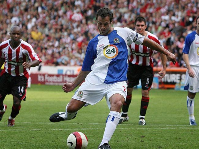 Lucas Neill takes a penalty for Blackburn Rovers.