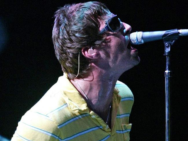 (FILES) British Liam (R) and Noel Gallagher, members of group "Oasis" perform during their concert at the Benicasim International Festival in Benicasim, Castellon, August 7, 2005. British rock legends Oasis announced on August 27, 2024 they will reunite for a worldwide tour next year, as brothers Liam and Noel Gallagher ended an infamous 15-year feud to unveil plans to return to the stage. The band, which helped create the Britpop era of the 1990s with hit songs "Wonderwall", "Don't Look Back In Anger" and "Champagne Supernova", announced on X it will play gigs in Cardiff, Manchester, London, Edinburgh and the Irish capital, Dublin. (Photo by JOSE JORDAN / AFP)