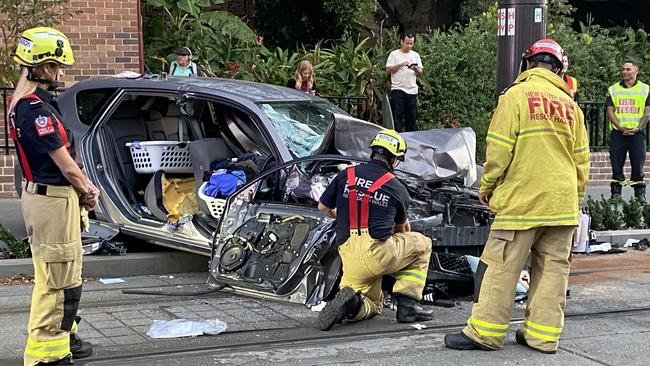 A driver had to be cut from his vehicle after it crashed into a tram on Thursday. Picture: Lachlan Leeming