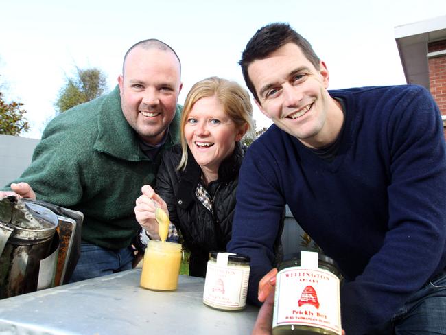 Wellington Apiary owners, Robin O'Brien (right) and his wife, Antonia O'Brien with Apiculture apprentice, Nick Graham of Kingston(left) and some of their now famous honey.