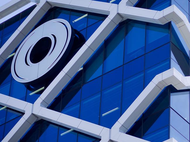 The Macquarie Group Ltd. logo is displayed on the facade of the Macquarie Group Building in Sydney, Australia, on Friday, April 27, 2012. Macquarie Group Ltd., Australia's largest investment bank, said it's relying on cost cuts to revive earnings after a slump in trading income and dealmaking dragged full-year net income to an eight-year low. Photographer: Ian Waldie/Bloomberg