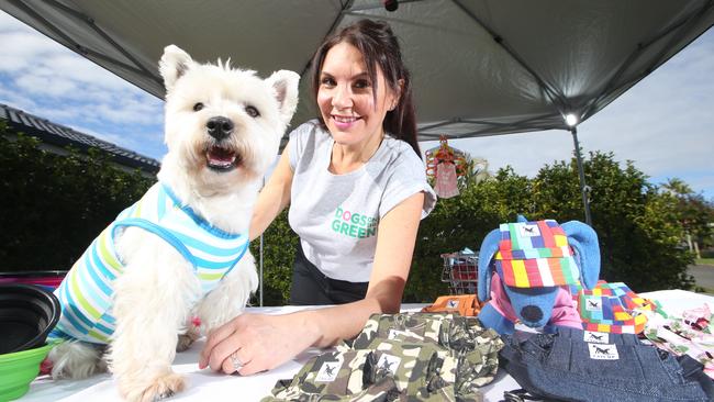 Rosalie with her dog Lucy the West Highland Terrier and her stall. Picture Glenn Hampson