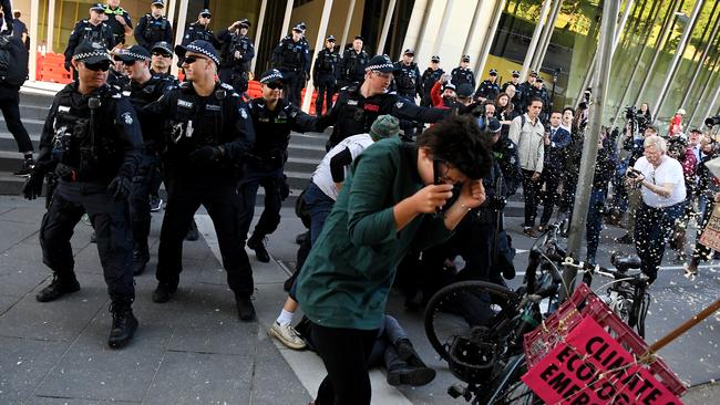 Police use pepper spray on protesters in Melbourne.