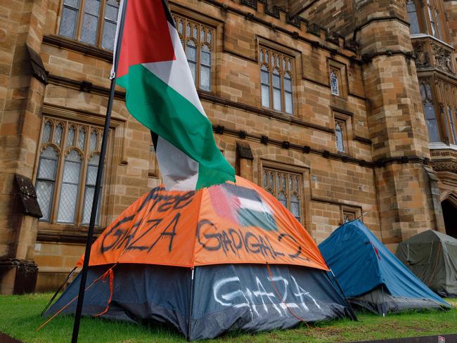 SYDNEY, AUSTRALIA - NewsWire Photos JUNE 15 2024. Scenes of pro-gaza & Palestine tent camp on the lawn of Sydney University. The uni has ordered the pro-Palestinian encampment to pack up and leave campus eight weeks after the tent protest appeared on its lawns. Picture: NewsWire / Max Mason-Hubers