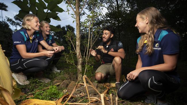 Amy Ridge, Hannah Buckling and Genevieve Longman learn indigenous bush skills with guides Elih and Jaawan Williams at Tribal Link in Mapleton. Picture: Lachie Millard