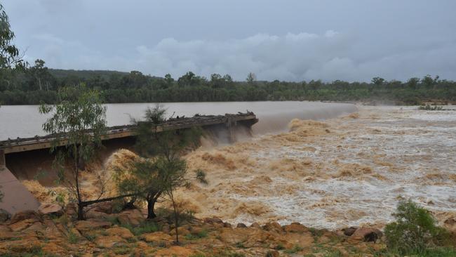 The water from the Burdekin River is rushing over the Charters Towers Weir following recent heavy rain in the district.