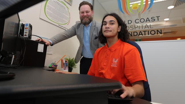 Alex Mackechnie donated $25,000 in winnings to the Gold Coast Hospital Foundation. He’s pictured here with the foundation’s Ben Cox. Picture: Glenn Hampsan