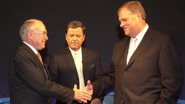 John Howard, left, presenter Ray Martin and Kim Beazley before a debate during the 2001 election campaign. Picture: John Feder