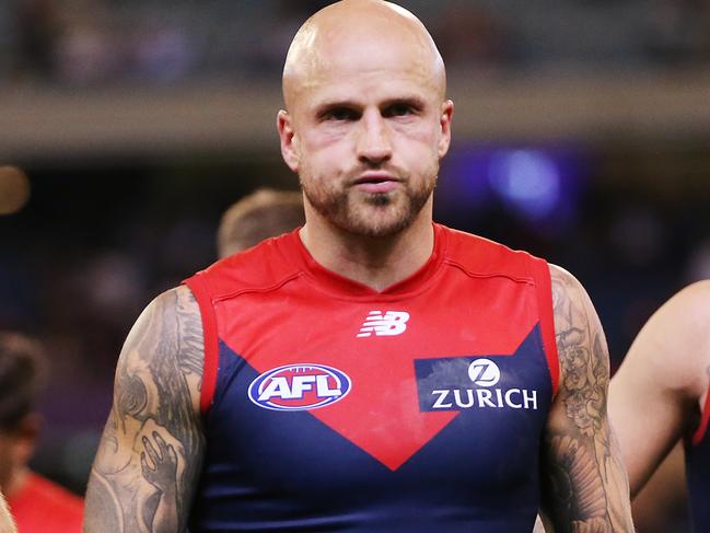 MELBOURNE, AUSTRALIA - APRIL 05: Nathan Jones of the Demons (C) looks dejected after defeat during the round three AFL match between the Melbourne Demons and the Essendon Bombers at Melbourne Cricket Ground on April 05, 2019 in Melbourne, Australia. (Photo by Michael Dodge/Getty Images)