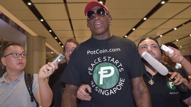 Dennis Rodman arrives at Changi International airport ahead of the summit. Picture: AFP.