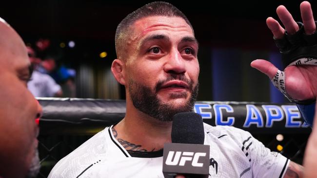 LAS VEGAS, NEVADA - MARCH 02: Tyson Pedro of Australia announces his retirement after a loss against Vitor Petrino of Brazil in a light heavyweight bout during the UFC Fight Night event at UFC APEX on March 02, 2024 in Las Vegas, Nevada. (Photo by Jeff Bottari/Zuffa LLC via Getty Images)