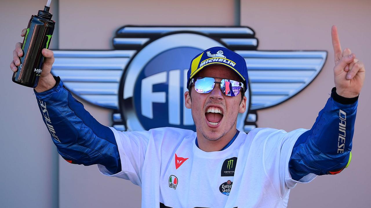 Joan Mir celebrates after winning the MotoGP world championship.5, 2020. (Photo by LLUIS GENE / AFP)