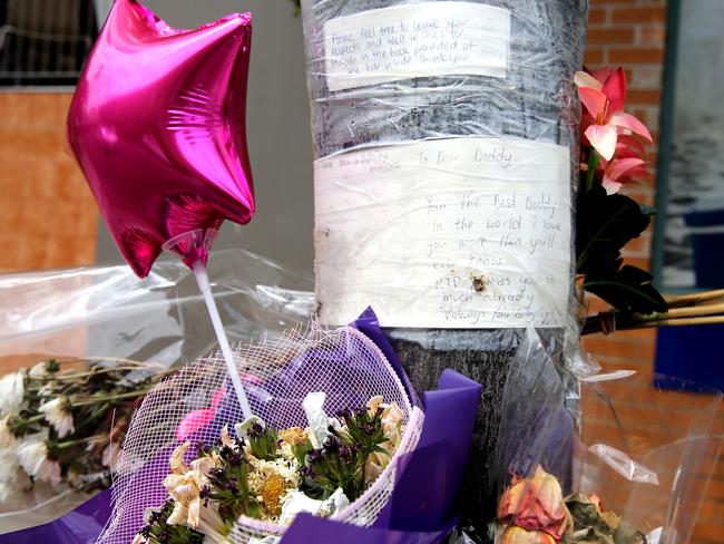 Flowers left at the scene where Haydn Butcher was punched by George Habkouk and died outside the lakes hotel at the entrance on the central coast. Picture: John Grainger