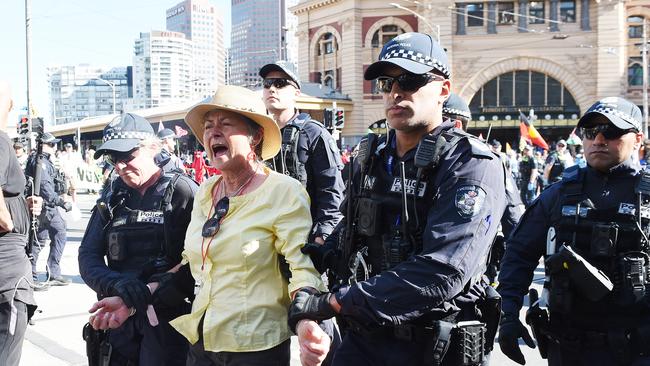 A protester is led away. Picture: Josie Hayden