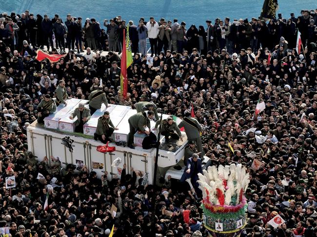 Coffins of Soleimani and others killed in the US drone strike are carried on a truck surrounded by mourners during a funeral procession in Tehran. Picture: AP