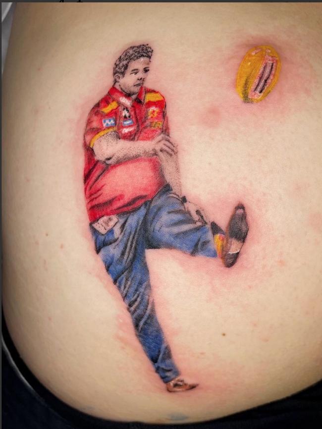 Suns coach Stuart Dew Daniel is now immortalised on his bum.