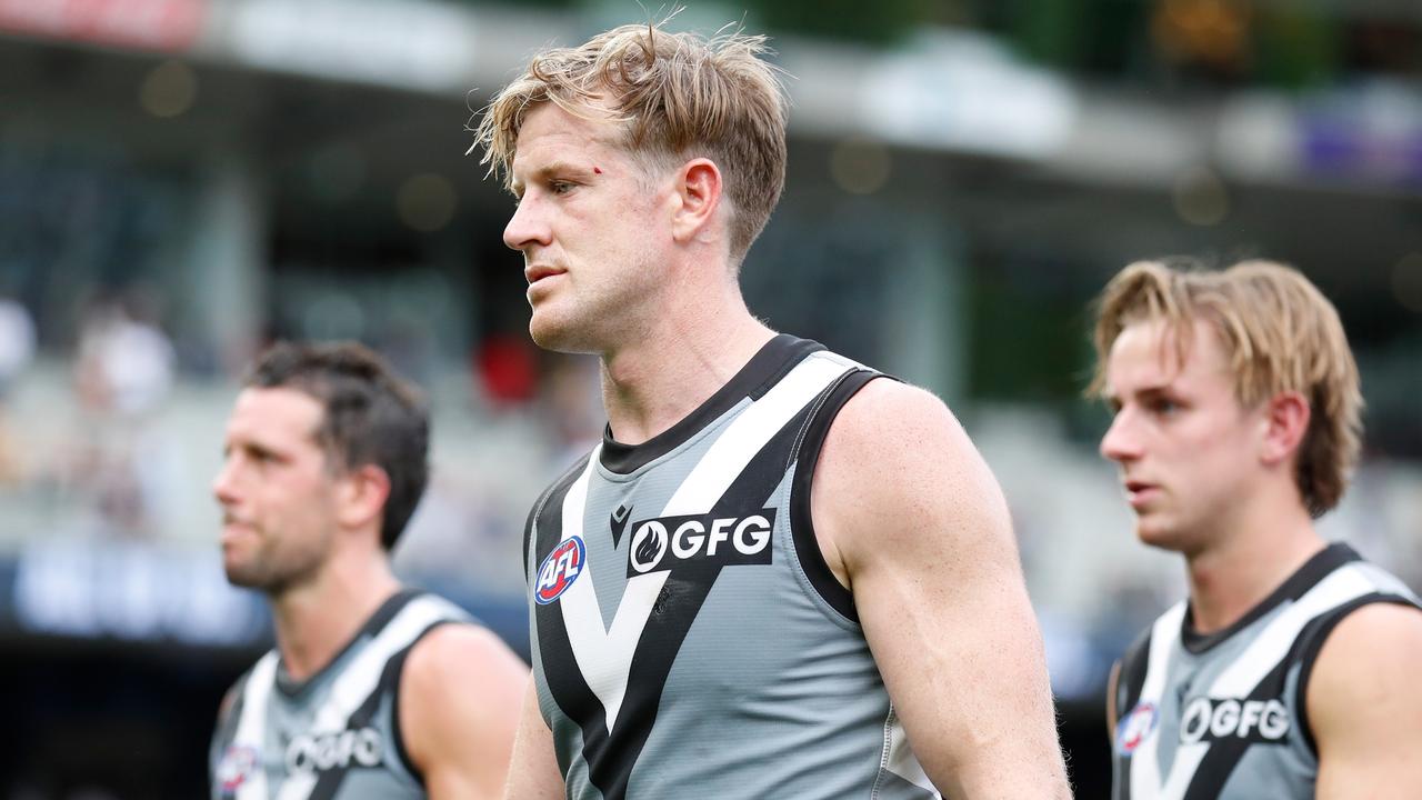 Power skipper Tom Jonas leads his side off the ground after the loss to the Blues. Picture: Michael Willson/AFL Photos