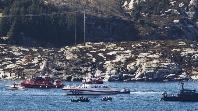 Search and rescue vessels patrol the waters off the island of Turoey in Norway after a helicopter crashed. Picture: Marit Hommedal/NTB Scanpix via AP